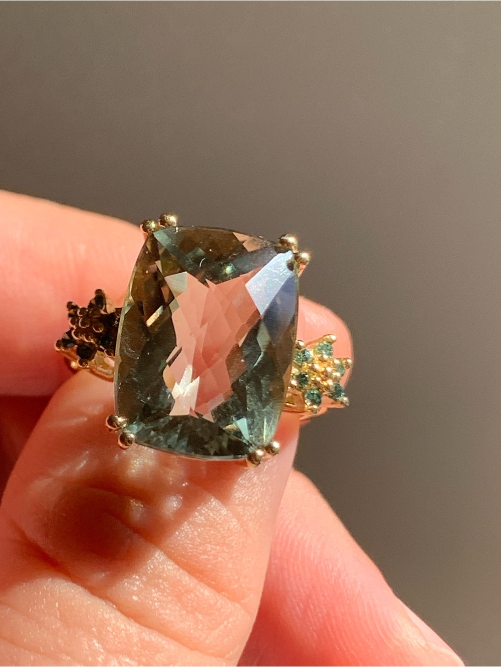 14k gold ring with Large Green Cushion-Cut Gemstone and sided Blue Diamonds
